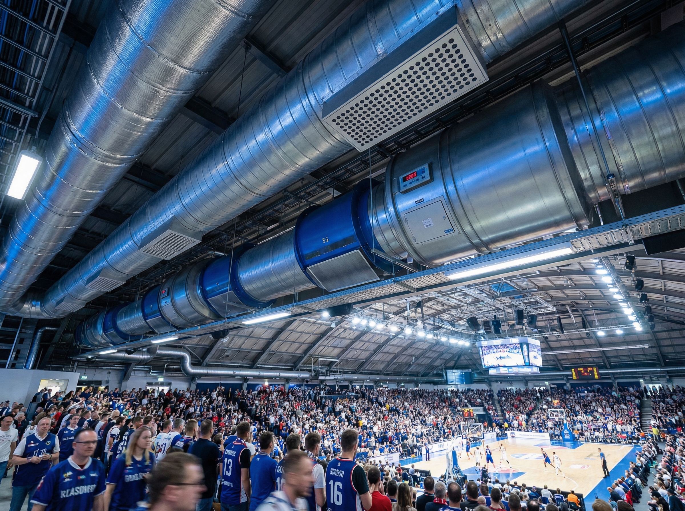An industrial HVAC system installed in a large sports arena, showcasing various components such as air handling units, ductwo
